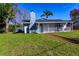 Newly renovated home exterior with walkway at 11416 Pine Forest Dr, New Port Richey, FL 34654