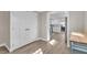 View into kitchen with white shaker cabinets and stainless steel appliances at 11416 Pine Forest Dr, New Port Richey, FL 34654