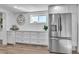 White kitchen features stainless steel appliances and ample counter space at 11416 Pine Forest Dr, New Port Richey, FL 34654