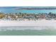 Aerial view of beach houses, beach and ocean at 1205 Gulf Way, St Pete Beach, FL 33706