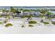 Aerial view of a beach house community with a beautiful beach at 1205 Gulf Way, St Pete Beach, FL 33706