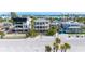 Aerial view of beach houses and a beautiful beach at 1205 Gulf Way, St Pete Beach, FL 33706