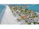 Aerial view of beach houses, beach and ocean at 1205 Gulf Way, St Pete Beach, FL 33706