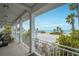 Spacious balcony with ocean view and seating at 1205 Gulf Way, St Pete Beach, FL 33706