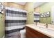 Bathroom with double vanity and shower/tub combo at 1205 Gulf Way, St Pete Beach, FL 33706