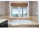 Relaxing bathroom with garden tub and ocean view at 1205 Gulf Way, St Pete Beach, FL 33706