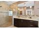 Bathroom with walk-in shower and double vanity at 1205 Gulf Way, St Pete Beach, FL 33706