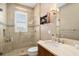 Clean bathroom with a large walk-in shower and updated vanity at 1205 Gulf Way, St Pete Beach, FL 33706