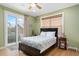 Charming bedroom with a queen-size bed and access to a private balcony at 1205 Gulf Way, St Pete Beach, FL 33706