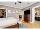 Spacious bedroom with large TV and ensuite bathroom access at 1205 Gulf Way, St Pete Beach, FL 33706