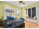 Bright bedroom with built-in window seat and ocean views at 1205 Gulf Way, St Pete Beach, FL 33706