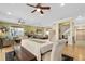 Bright dining room features a spacious table, hardwood floors, and a view into the living area at 1205 Gulf Way, St Pete Beach, FL 33706