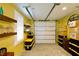 Garage with shelves, storage bins and a door at 1205 Gulf Way, St Pete Beach, FL 33706