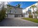 Two-story house with driveway, garage and pergola at 1205 Gulf Way, St Pete Beach, FL 33706