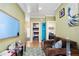 Small living area with couch and access to bathroom at 1205 Gulf Way, St Pete Beach, FL 33706