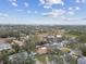 Aerial view featuring diverse homes surrounded by lush greenery in a well-established neighborhood at 12840 Sophia Cir, Largo, FL 33774