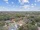 Aerial view of the property showcasing the home's layout within a lush, tree-filled neighborhood at 12840 Sophia Cir, Largo, FL 33774