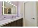 Modern bathroom featuring a stylish vanity with a well-lit LED mirror and sleek hardware at 12840 Sophia Cir, Largo, FL 33774