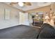 Bedroom showcasing wood-look floors, ceiling fan and a large sliding mirror closet door at 12840 Sophia Cir, Largo, FL 33774