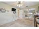 Bedroom featuring carpet flooring, neutral walls, ceiling fan, closet doors, and an ensuite entrance at 12840 Sophia Cir, Largo, FL 33774