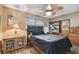 Charming bedroom featuring a ceiling fan, wood-look floors and neutral colored walls at 12840 Sophia Cir, Largo, FL 33774