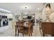 The dining area features a wooden table with a modern chandelier and an open layout connected to the kitchen and living room at 12840 Sophia Cir, Largo, FL 33774