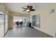 Bright sunroom with tile floor, ceiling fan and clear access to the patio and backyard at 12840 Sophia Cir, Largo, FL 33774