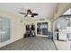Bright sunroom with tile floor, ceiling fan and access to the back yard grilling area at 12840 Sophia Cir, Largo, FL 33774