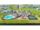 Aerial view of community amenities including pool, playground and tennis court at 12902 Brookside Moss Dr, Riverview, FL 33579