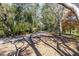 Paved path winding through a wooded area at 1375 Carlisle Ct, Dunedin, FL 34698