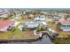 Aerial view of canal-front home with RV parking at 141 Singapore Rd, Punta Gorda, FL 33950
