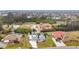 Aerial view of canal-front home and neighborhood at 141 Singapore Rd, Punta Gorda, FL 33950