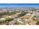 Wide aerial view showing home, canal, and neighborhood at 141 Singapore Rd, Punta Gorda, FL 33950