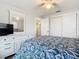 Bright bedroom with double closet and view into bathroom at 141 Singapore Rd, Punta Gorda, FL 33950