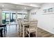 Charming dining area with sliding glass doors leading to patio at 141 Singapore Rd, Punta Gorda, FL 33950