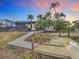 Private dock with walkway leading to the canal at sunset at 141 Singapore Rd, Punta Gorda, FL 33950