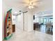 Bright hallway with barn door and access to laundry room at 141 Singapore Rd, Punta Gorda, FL 33950