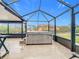Relax in this hot tub on the screened patio, overlooking the backyard at 141 Singapore Rd, Punta Gorda, FL 33950
