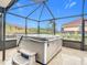 Enjoy this hot tub, under a screened patio, overlooking the canal at 141 Singapore Rd, Punta Gorda, FL 33950