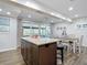 Island kitchen with granite countertops and view into dining area at 141 Singapore Rd, Punta Gorda, FL 33950