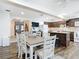 Modern kitchen with granite countertops, dark cabinets, and stainless steel appliances at 141 Singapore Rd, Punta Gorda, FL 33950
