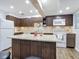 Granite kitchen island with seating and ample storage at 141 Singapore Rd, Punta Gorda, FL 33950