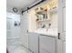 Convenient laundry room with washer, dryer, and storage shelves at 141 Singapore Rd, Punta Gorda, FL 33950