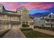 White three-story townhouse with two-car garage and manicured lawn at 14723 Seminole Trl, Seminole, FL 33776