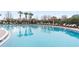 Relaxing community pool with lounge chairs and palm trees at 18452 Merseyside Loop, Land O Lakes, FL 34638