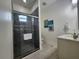 Modern bathroom with walk-in shower, tile flooring, and tasteful artwork at 2026 20Th Avenue Pkwy, Indian Rocks Beach, FL 33785