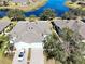Aerial view of home and neighborhood near a lake at 2071 Sifield Greens Way # 103, Sun City Center, FL 33573