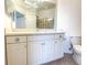 Bathroom with vanity, toilet and mirrored medicine cabinet at 2071 Sifield Greens Way # 103, Sun City Center, FL 33573
