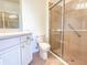 Bathroom with shower, toilet and vanity at 2071 Sifield Greens Way # 103, Sun City Center, FL 33573