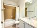 Bathroom with bathtub, shower, and vanity at 2071 Sifield Greens Way # 103, Sun City Center, FL 33573